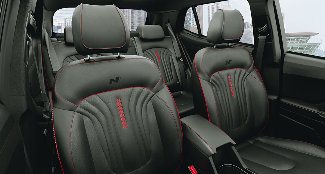 Sporty black interiors with athletic red inserts